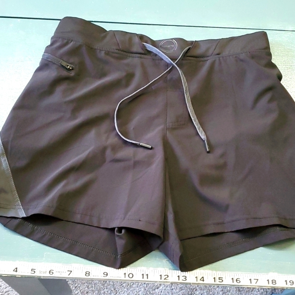 HYLETE WOMEN'S,  Black shorts‎ size small high cut. Zipper pocket. Tie..